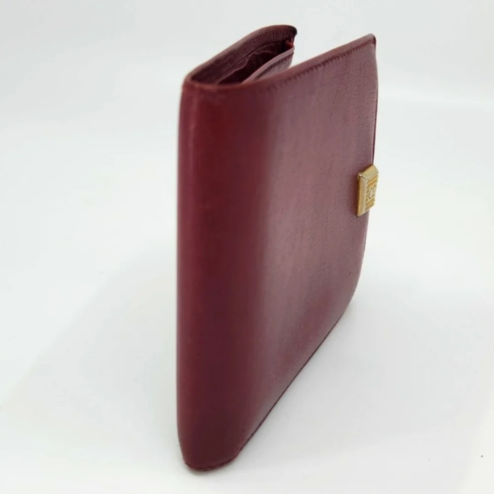 Dior Burgundy Wallet with Gold “CD” Accent. Good condition.